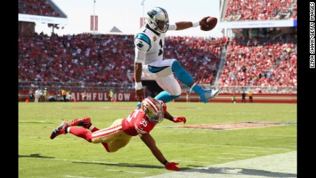 Cam Newton #1 of the Carolina Panthers is tackled by Eric Reid #35 of the San Francisco 49ers on September 10, 2017.