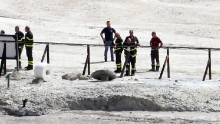 The coffin of  three people died in the crater stand under the green cloth at Pozzuoli, Naples, Italy, 12 settembre 2017. A couple and an 11-year-old boy have died at the Solfatara volcanic crater at Pozzuoli, near Naples, police said on Tuesday. Another child, aged seven, survived, the sources said. The woman was 42 and the man was 45. 