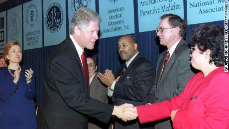 WASHINGTON: US President Bill Clinton talks to Dr. Elena Rios and other physicians that announced their support for his health reform package during a ceremony at the White House. Behind Clinton is First Lady Hillary Clinton on December 16. 