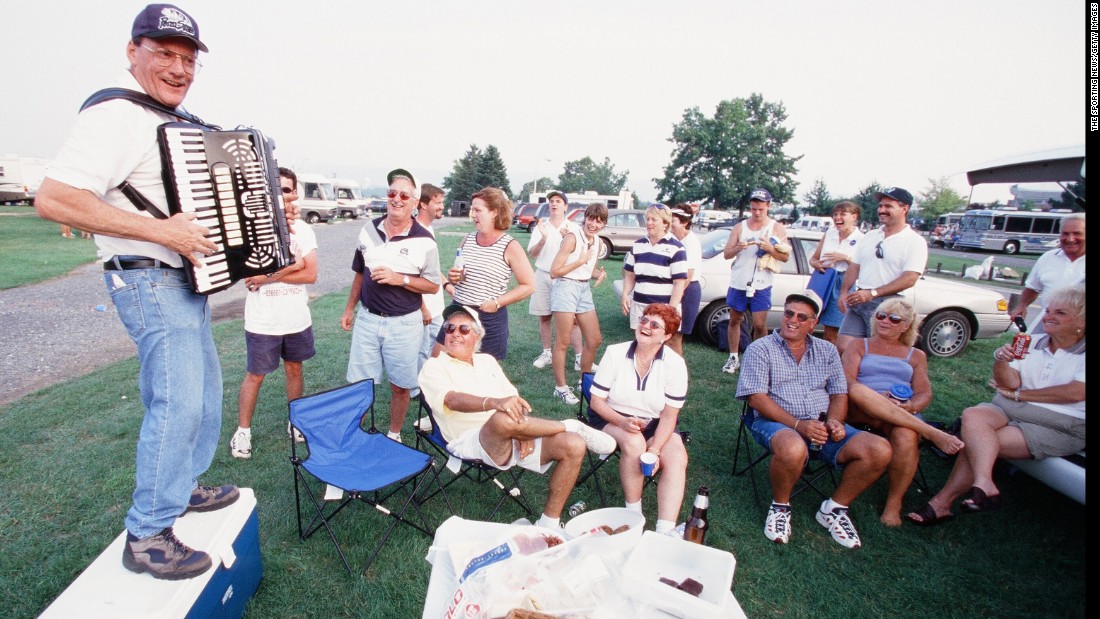 It&#39;s not just about food and drinks: music is also a key part of any tailgating party. Here, an accordion player entertains Penn State fans in 1999.