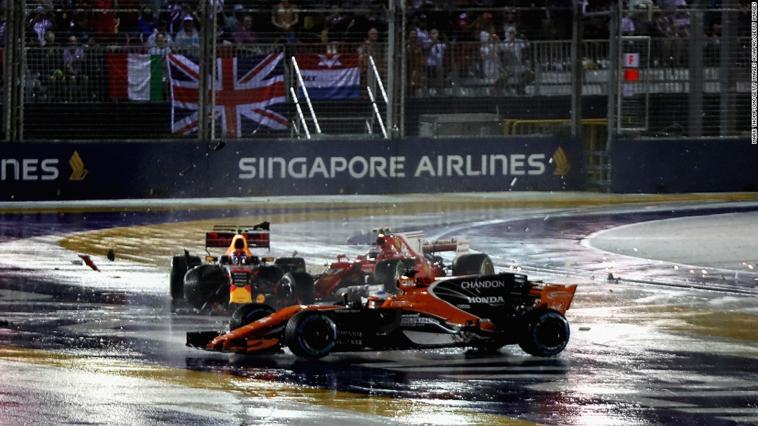 Fernando Alonso (foreground) was caught up in the crash between Max Verstappen and Kimi Raikkonen at the start of the Singapore Grand Prix 