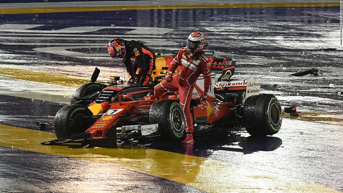 Kimi Raikkonen (right) and Max Verstappen step out of their cars after colliding at Sunday&#39;s Singapore Grand Prix 
