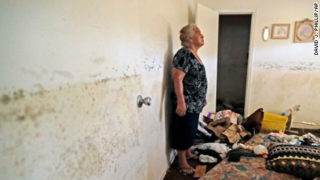 Florentina Amaya, 71, contemplates the mold growing inside her Houston home in the aftermath of Hurricane Harvey.