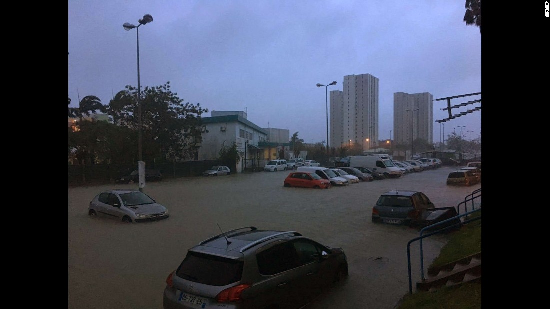 Floodwaters surround cars in Pointe-a-Pitre on September 19.