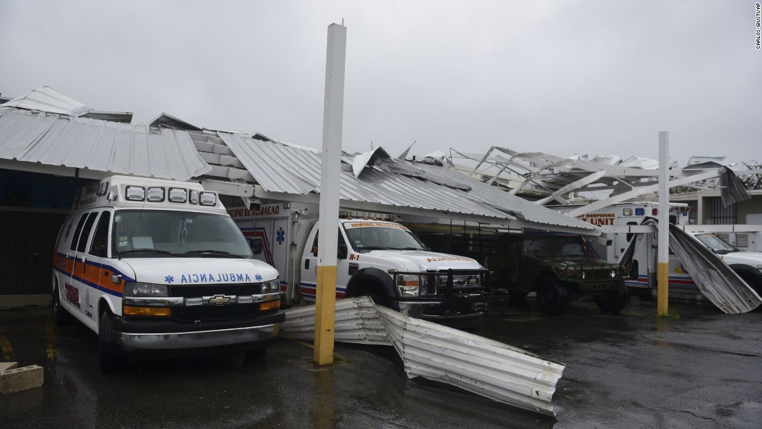 Rescue vehicles are trapped under an awning in Humacao on September 20.