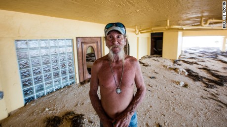 William &quot;Dub&quot; Richardson, caretaker of Seapointe condos, stands on three feet of sand that washed in.