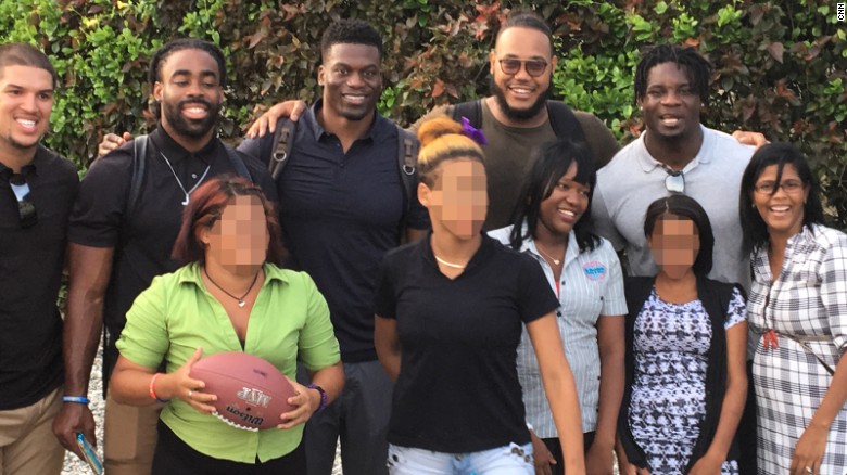 NFL players and women of Lily House, a rehabilitation facility for victims of sex trafficking. CNN has blurred some of the faces in this photo in order to respect their privacy.
