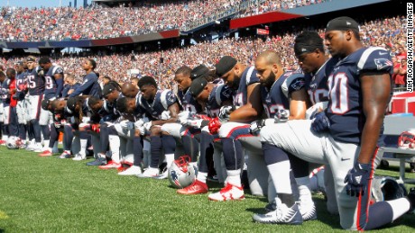 Members of the New England Patriots kneel during the National Anthem before a game against the Houston Texans on September 24, 2017 in Foxboro, Massachusetts. 