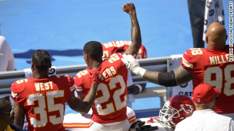 Sep 24, 2017; Carson, CA, USA; Kansas City Chiefs defensive back Marcus Peters (22) protests next to running back Charcandrick West (35) and defensive tackle Roy Miller (98) during the National Anthem prior to the game against the Los Angeles Chargers at StubHub Center. Mandatory Credit: Kelvin Kuo-USA TODAY Sports