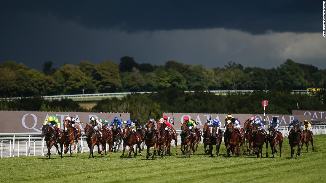Frankie Dettori rode Lancelot Du Lac (left) to victory in the esteemed Stewards Cup on a stormy day five of the Qatar Goodwood Festival.