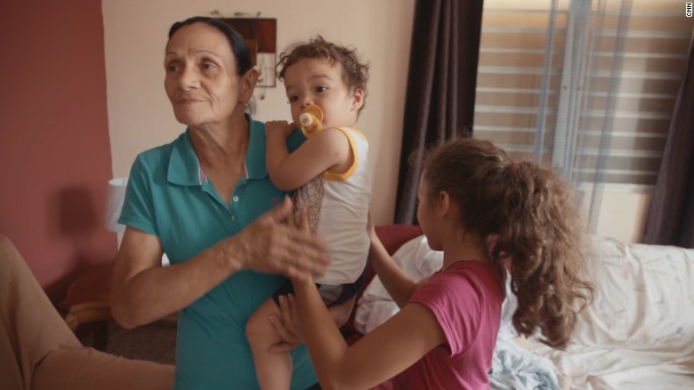 Grandmother rations crackers in Puerto Rico