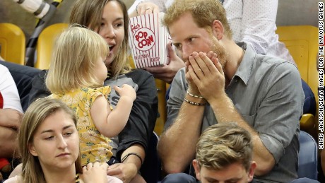 Prince Harry amuses Emily Henson, daughter of Hayley Henson, at the Sitting Volleyball Finals during the Invictus Games in September this year.