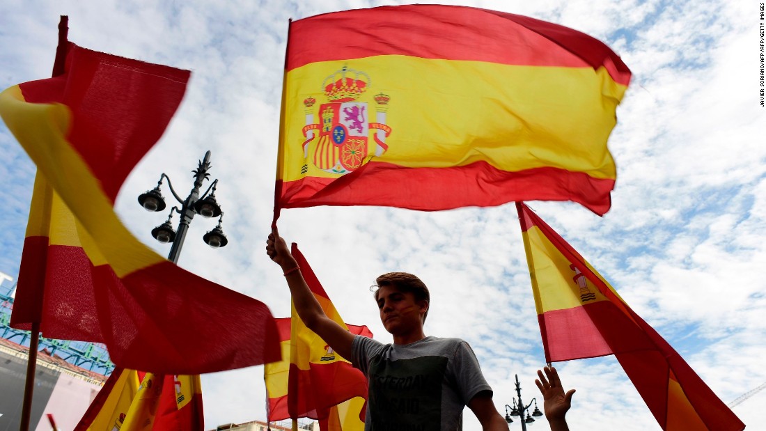 People attend a demonstration against a referendum on independence for Catalonia on October 1 in Madrid, Spain.