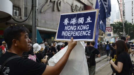 A pro-independence activist marches in Hong Kong&#39;s Admiralty district on October 1. 