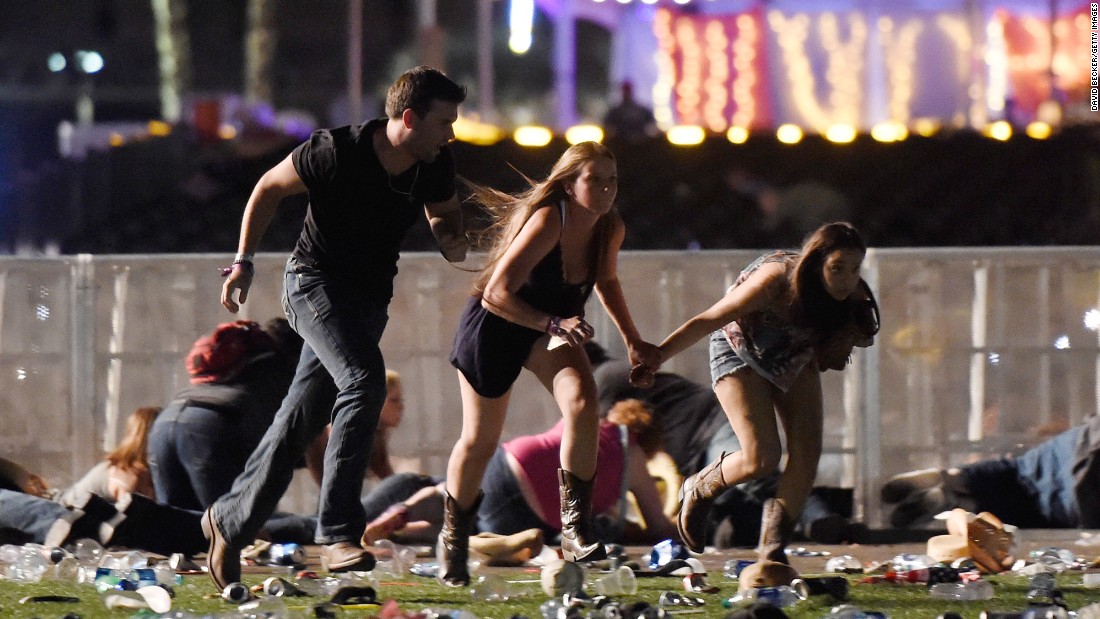 People run from the festival grounds.