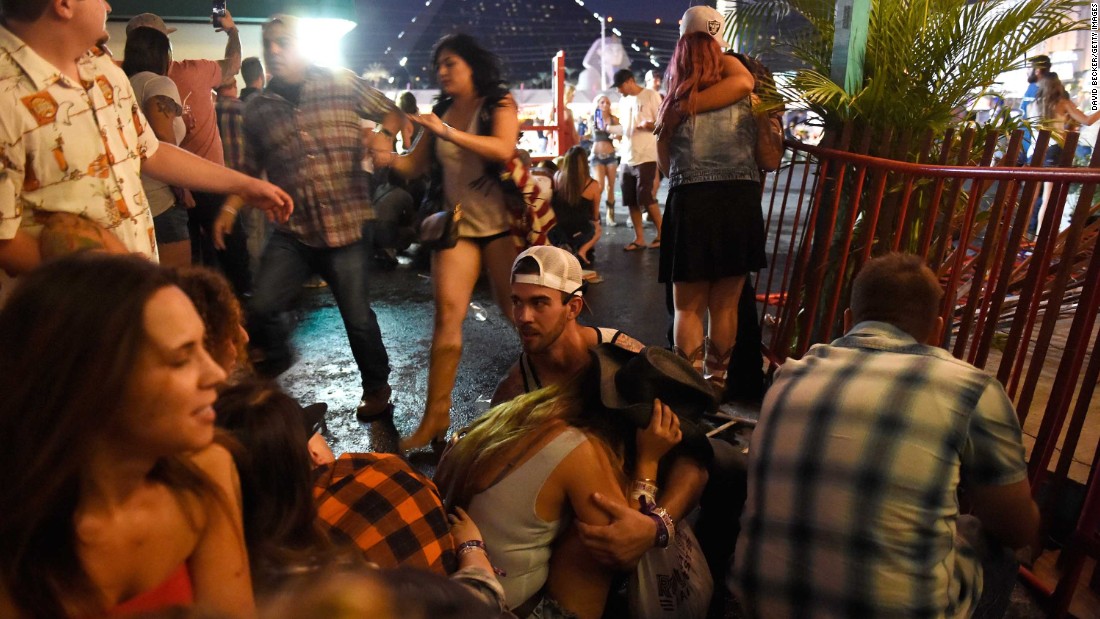 A crowd takes cover at the festival grounds.