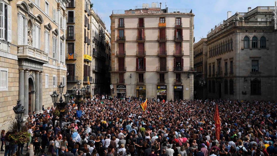 People attend a protest in Barcelona on Monday, October 2, a day after hundreds were injured in a police crackdown during the banned referendum. The Catalan government claimed victory after pushing forward with the vote despite Spain&#39;s Constitutional Court declaring it illegal.