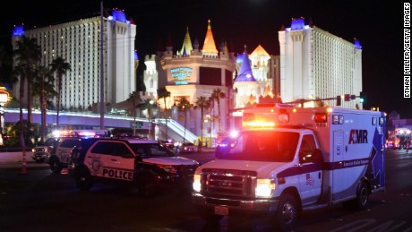 LAS VEGAS, NV - OCTOBER 02:  An ambulance leaves the intersection of Las Vegas Boulevard and Tropicana Ave. after a mass shooting at a country music festival nearby on October 2, 2017 in Las Vegas, Nevada. A gunman has opened fire on a music festival in Las Vegas, leaving at least 20 people dead and more than 100 injured. Police have confirmed that one suspect has been shot. The investigation is ongoing. (Photo by Ethan Miller/Getty Images)