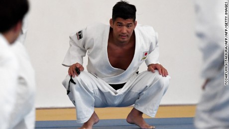 Japanese national judo team head coach Kosei Inoue (C) looks at his athletes during the open training session in Rio de Janeiro on August 1, 2016 ahead of Rio 2016 Olympic Games. / AFP / TOSHIFUMI KITAMURA        (Photo credit should read TOSHIFUMI KITAMURA/AFP/Getty Images)