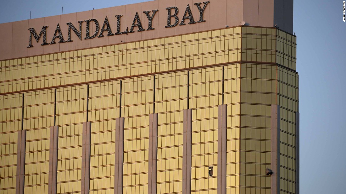 Broken windows of the Mandalay Bay are seen early in Las Vegas on Monday. Police said the gunman fired on the crowd from the 32nd floor of the hotel.