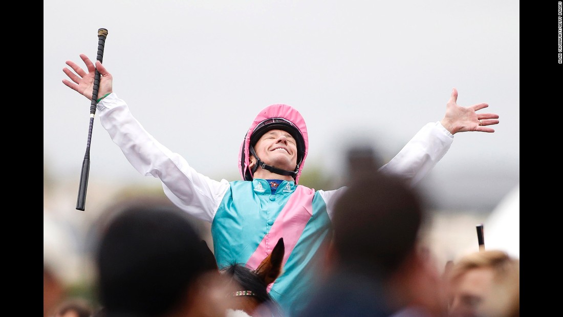 Frankie Dettori celebrates after riding Enable to win the Prix de l&#39;Arc de Triomphe at Chantilly Racecourse on October 1, 2017 in Chantilly, France.