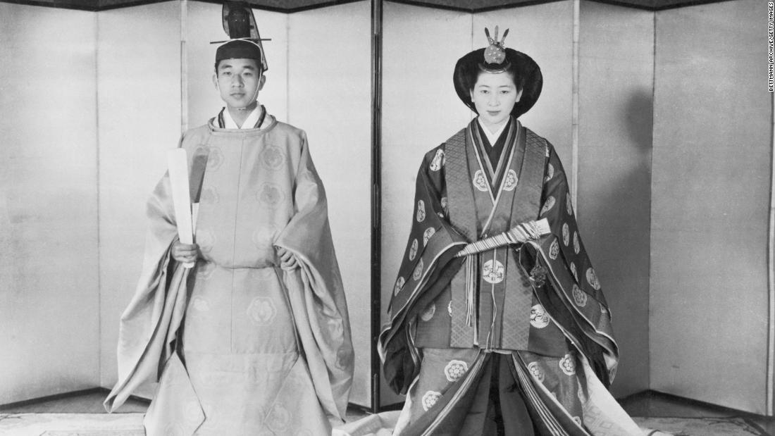 Akihito and Michiko pose in traditional Japanese wedding costumes before their marriage in April 1959.