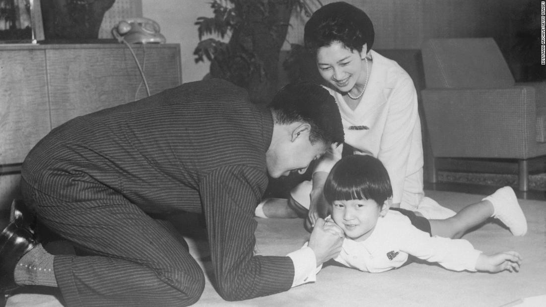 Akihito arm-wrestlers Naruhito while Michiko looks on. The couple had another son, Fumihito, in 1965. Their only daughter, Sayako, was born in 1969.