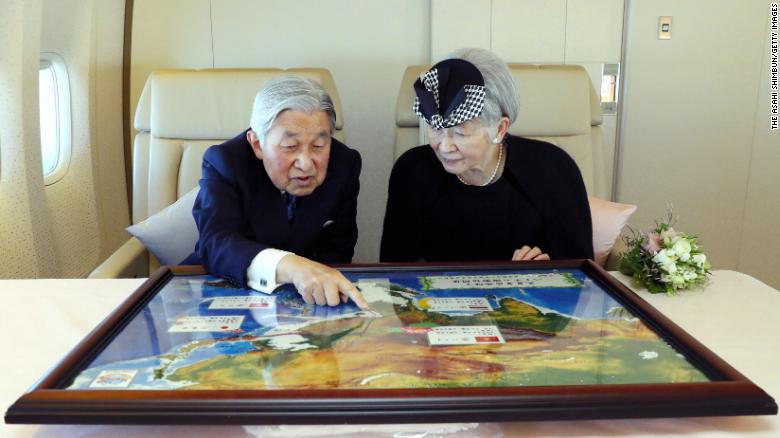 Akihito and Michiko sit together during a flight to Vietnam in February 2017.