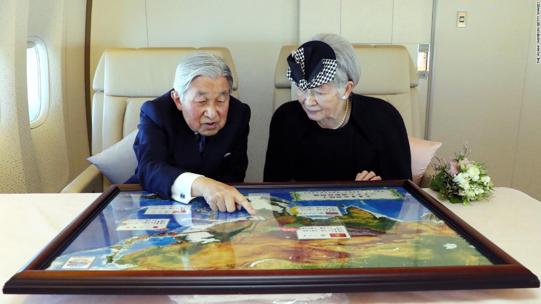 Akihito and Michiko sit together during a flight to Vietnam in February 2017.