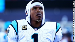 A bystander says Cam Newton offered $1,500 to trade seats with another passenger. He was rejected
