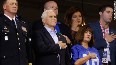 Vice President Mike Pence, front center, stands during the playing of the national anthem before an NFL football game between the Indianapolis Colts and the San Francisco 49ers, Sunday, Oct. 8, 2017, in Indianapolis. (AP Photo/Michael Conroy)