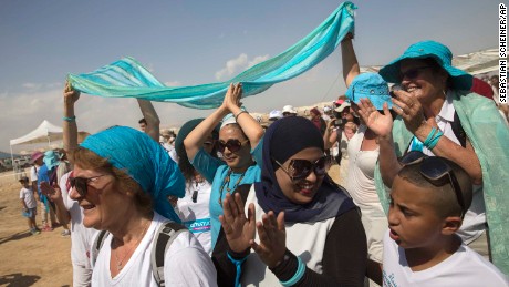 Palestinian and Israeli women take part in a peace march near the Dead Sea.