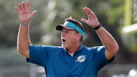 FILE - In this Aug. 16, 2016, file photo, Miami Dolphins offensive line coach Chris Foerster watches as players do drills during practice at NFL football training camp in Davie, Fla. The NFL and the Miami Dolphins say they&#39;re aware of a social media video allegedly showing offensive line coach Chris Foerster snorting a white powdery substance. NFL spokesman Brian McCarthy said Monday, Oct. 9, 2017, the league will review the 56-second video, which was posted on Facebook and Twitter. (AP Photo/Lynne Sladky, File)