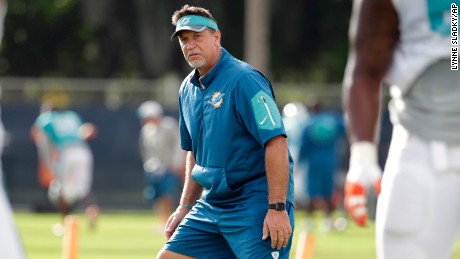 Miami Dolphins offensive line coach Chris Foerster watches as players do drills during a training camp in Davie, Florida.