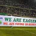 nigeria players celebrate world cup qualification banner