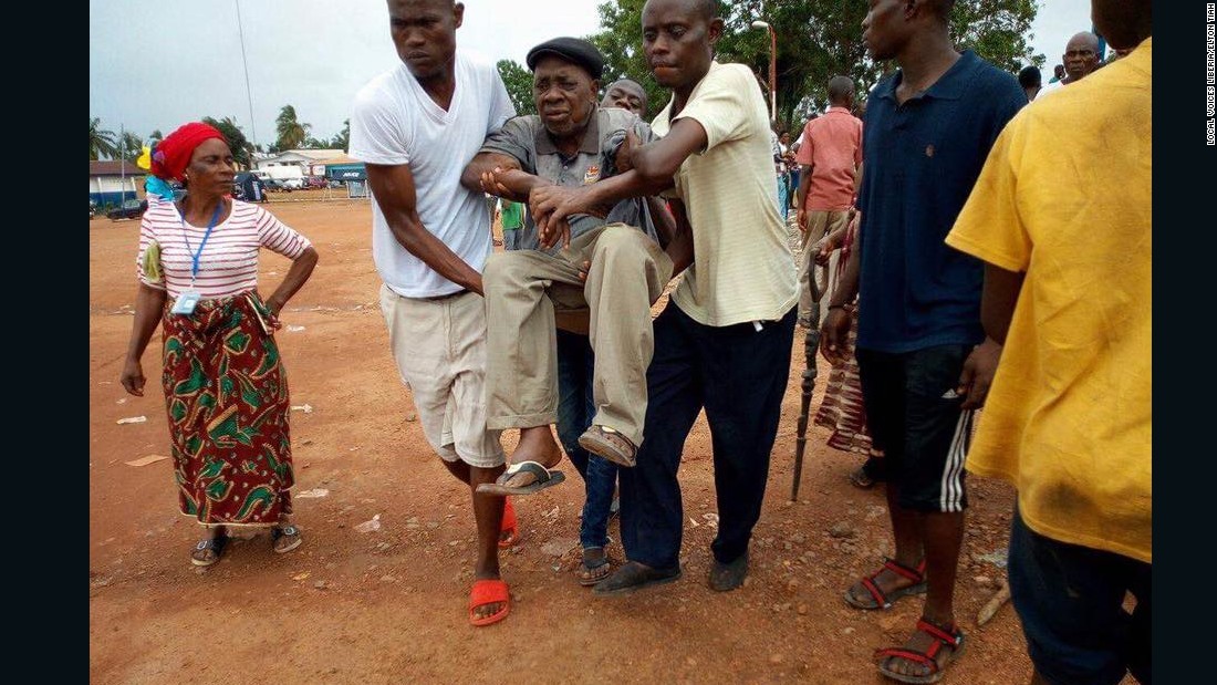 An elderly man is rushed to the Liberian government hospital in Buchanan, after he fainted due to the long, hot wait in a queue outside the Fairground Community polling station in Grand Bassa County.&lt;br /&gt;Credit: Local Voices Liberia/Elton Tiah