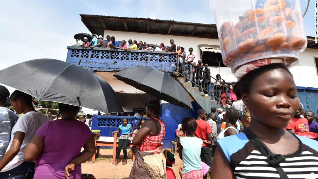 People waiting patiently outside a polling station in Monrovia to cast their votes. &lt;br /&gt;Credit: Getty images