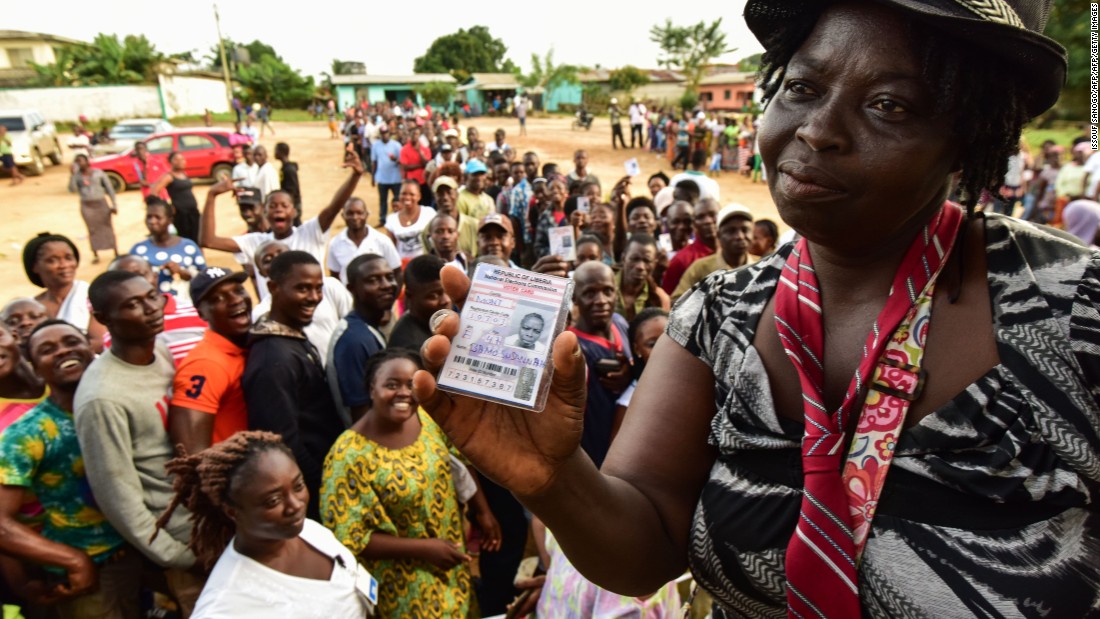 A woman shows her voting card during the elections. &lt;br /&gt;Credit: Getty images