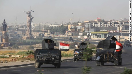 Iraqi forces advance to the center of Kirkuk during the operation against Kurdish fighters.