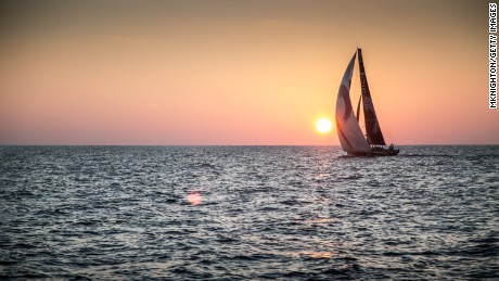 AT SEA - JANUARY 7: In this handout image provided by the Volvo Ocean Race, onboard Abu Dhabi Ocean Racing. A silhouetted Team Alvimedica behind an Indian Ocean Sunset as Abu Dhabi Ocean Racing rolls underneath them into third place during Leg 3 Abu Dhabi, UAE and Sanya, China. The Volvo Ocean Race 2014-15 is the 12th running of this ocean marathon. Starting from Alicante in Spain on October 11, 2014, the route, spanning some 39,379 nautical miles, visits 11 ports in 11 countries (Spain, South Africa, United Arab Emirates, China, New Zealand, Brazil, United States, Portugal, France, the Netherlands and Sweden) over nine months. The Volvo Ocean Race is the world&#39;s premier ocean race for professional racing crews. (Photo by Matt Knighton/Abu Dhabi Ocean Racing/Volvo Ocean Race via Getty Images)