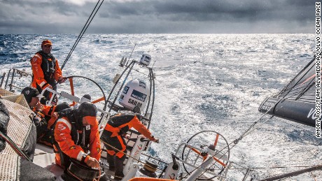 March 22,2015. Leg 5 to Itajai onboard Team Alvimedica. Day 4. Charlie Enright on the helm as the clouds part for a momentary glimpse of sunlight with rain and squalls on the horizon. Conditions remain variable and puffy for the last 48 hours until the next low pressure system takes over,forecasted to bring a quick rise in wind and waves.