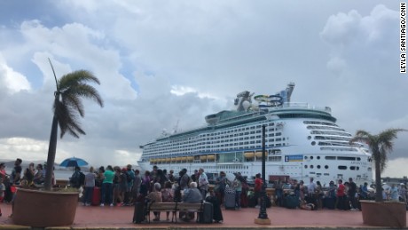 Puerto Ricans line up to try and board a cruise ship to leave the island.