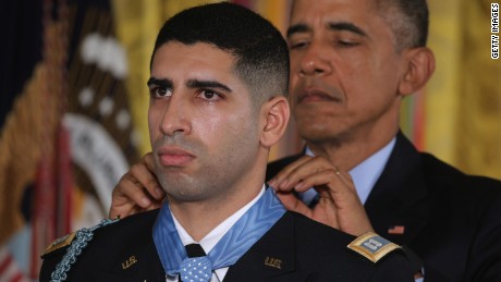 WASHINGTON, DC - NOVEMBER 12:  U.S. President Barack Obama (R) presents the Medal of Honor to retired Army Captain Florent Groberg during an East Room ceremony at the White House November 12, 2015 in Washington, DC. Born in France and a naturalized U.S. citizen, Groberg received the Medal of Honor for tackling a suicide bomber and saving fellow soldiers&#39; lives in Afghanistan&#39;s Kunar Province in August 2012. He was also badly injured in the attack, which killed four people.  (Photo by Chip Somodevilla/Getty Images)