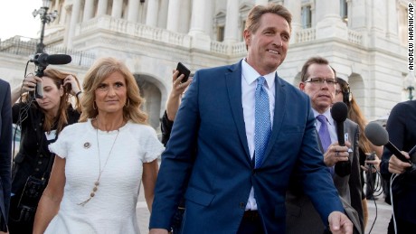 Sen. Jeff Flake, R-Ariz., accompanied by his wife Cheryl, leaves the Capitol in Washington, Tuesday, Oct. 24, 2017, after announcing he won&#39;t seek re-election in 2018. (AP Photo/Andrew Harnik)