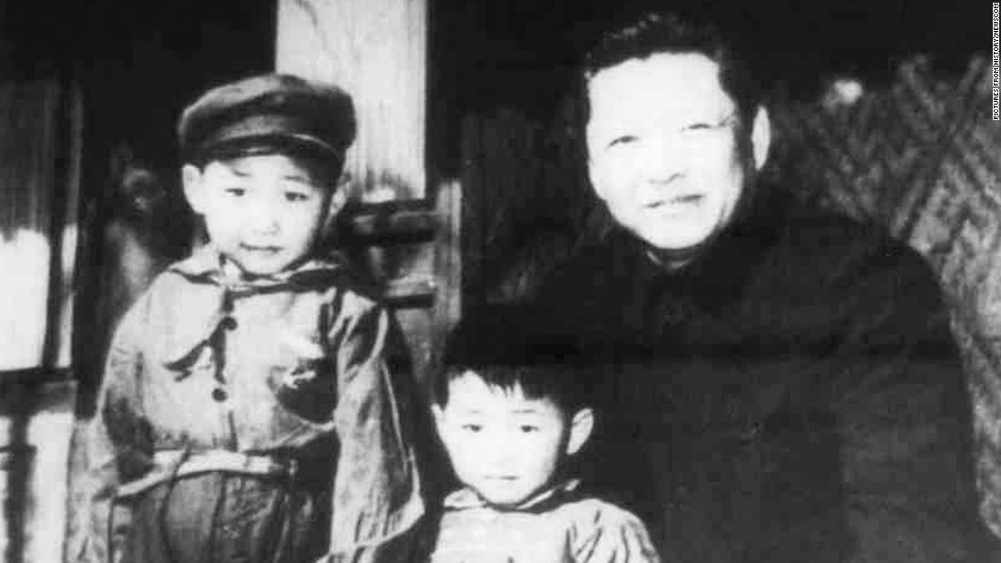 XI, left, stands with his father, Xi Zhongxun, and his younger brother, Xi Yuanping, in 1958. Xi Zhongxun was a communist revolutionary who held several positions in the National People&#39;s Congress.