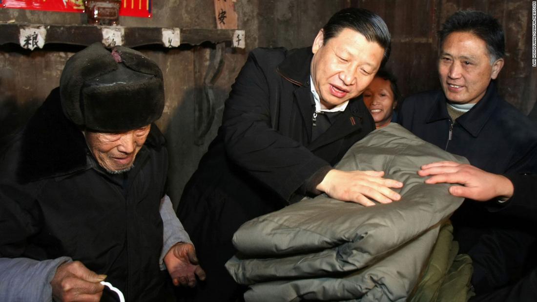 Xi brings blankets to a villager after ice storms in 2008. That year, Xi became China&#39;s vice president.