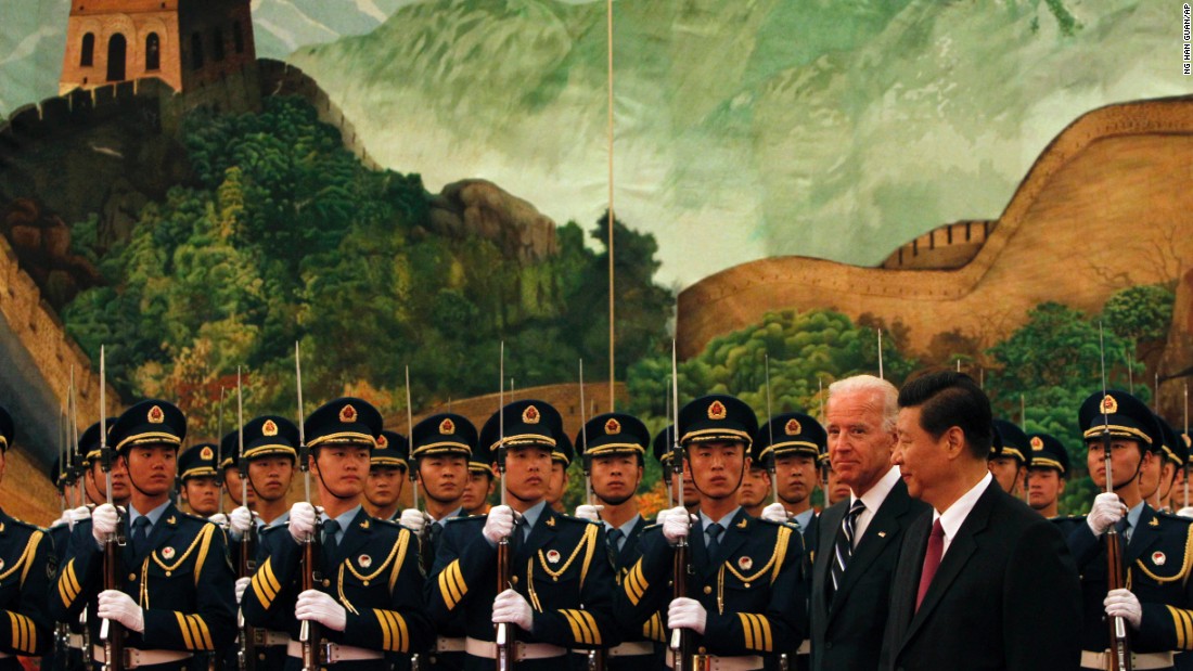 Xi and US Vice President Joe Biden inspect an honor-guard contingent during a welcoming ceremony in Beijing in 2011.