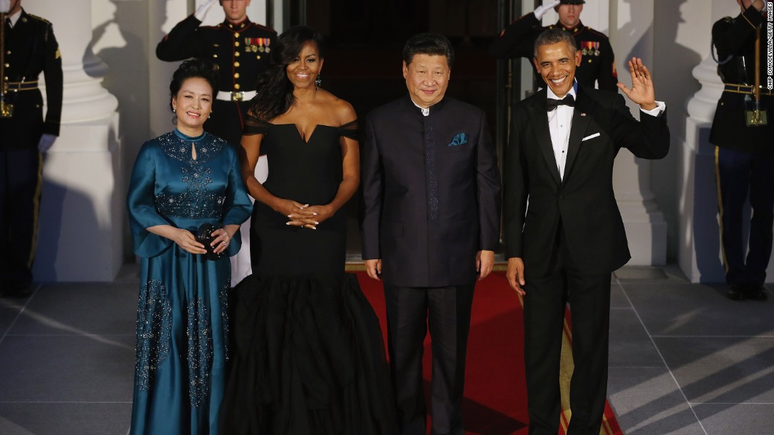 Xi and Peng pose with the Obamas before a state dinner in Washington in 2015.