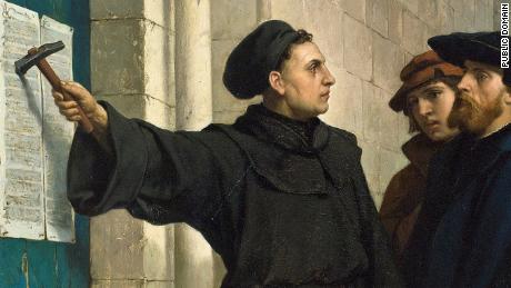 Martin Luther posting his 95 theses on the church door, created in 1871.
