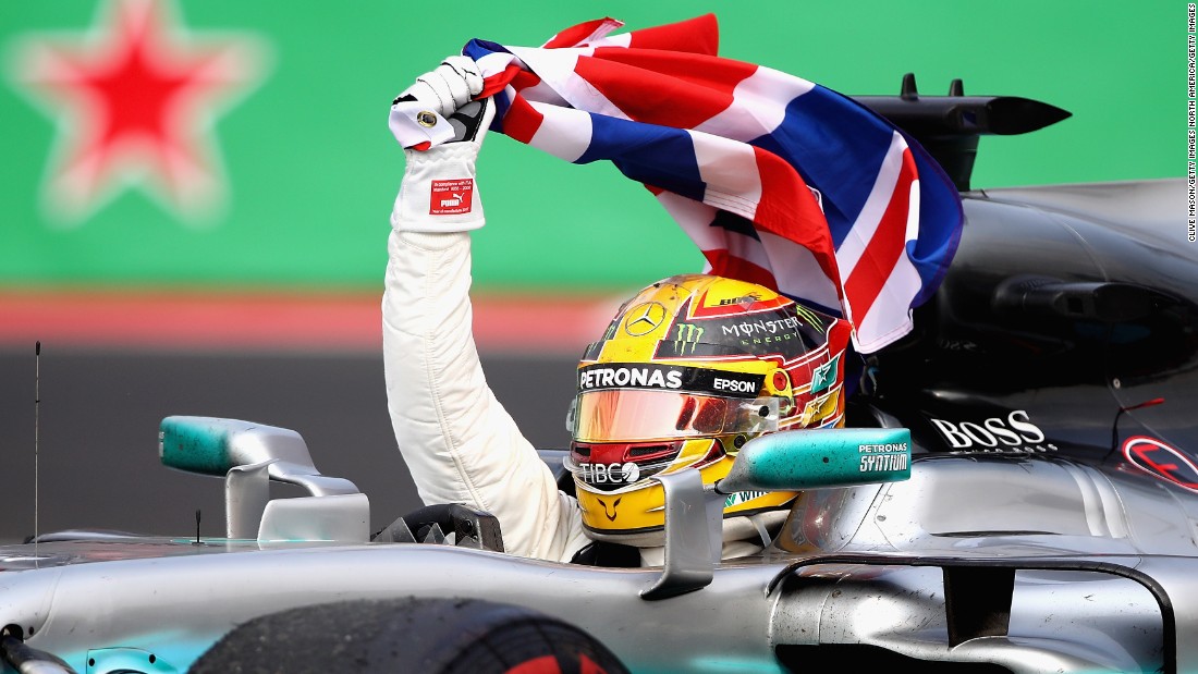 Lewis Hamilton celebrates at the Mexican Grand Prix after winning a fourth F1 drivers&#39; title. 